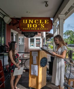 Uncle Bo's Haleiwa Host Greeting Customer